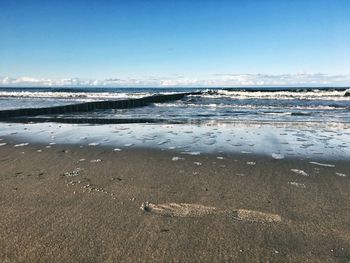 Scenic view of beach against sky