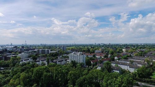 High angle view of trees and buildings against sky