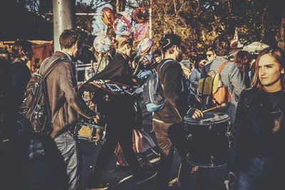 People standing on street in city