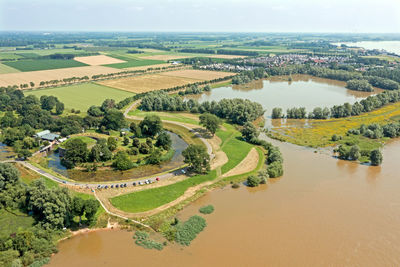 High angle view of river amidst landscape against sky