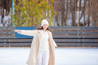 Rear view of woman standing in park