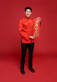 Full length of a smiling young man