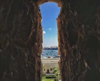 View of sea seen through arch window of qaitbay citadel in alexandria