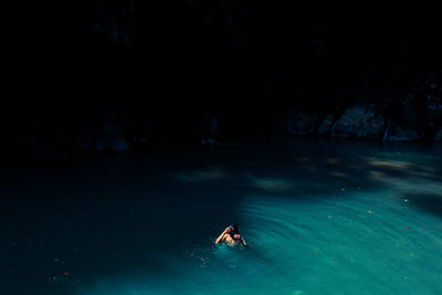 High angle view of man swimming in lake