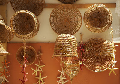 Clothes hanging in basket for sale at market stall