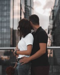 Rear view of couple standing outdoors