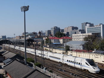 High angle view of train in city against clear sky