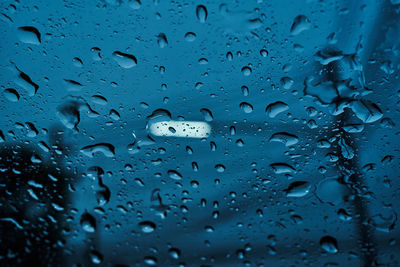 Close-up of water drops on glass