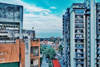 Buildings in town against sky