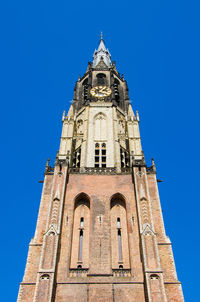 Low angle view of building against clear blue sky