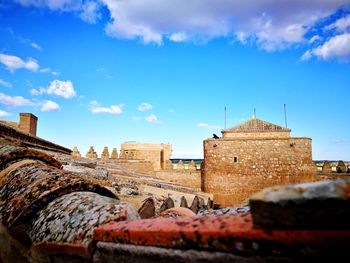 Old ruins of building against blue sky