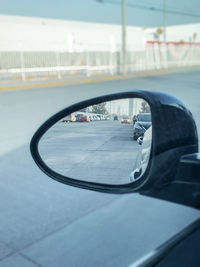 Reflection of road in side-view mirror