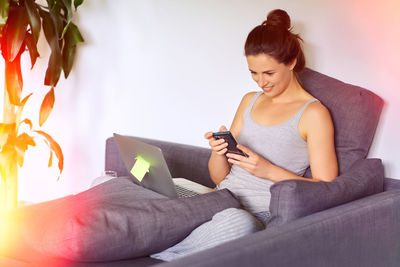 Young woman using mobile phone