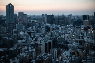 High angle view of modern buildings in city against sky