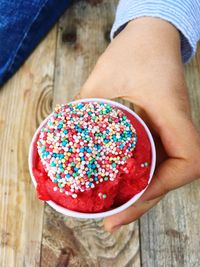 Close-up of hand holding ice cream