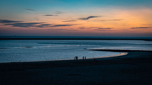 Scenic view of sea against sky at sunset