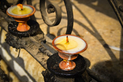 Close-up of burning candle outdoors