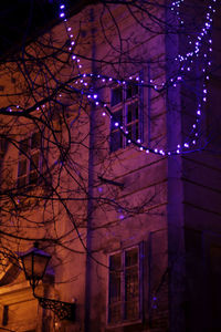 Low angle view of illuminated building at night