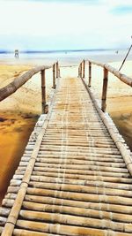 Pier over sea against sky