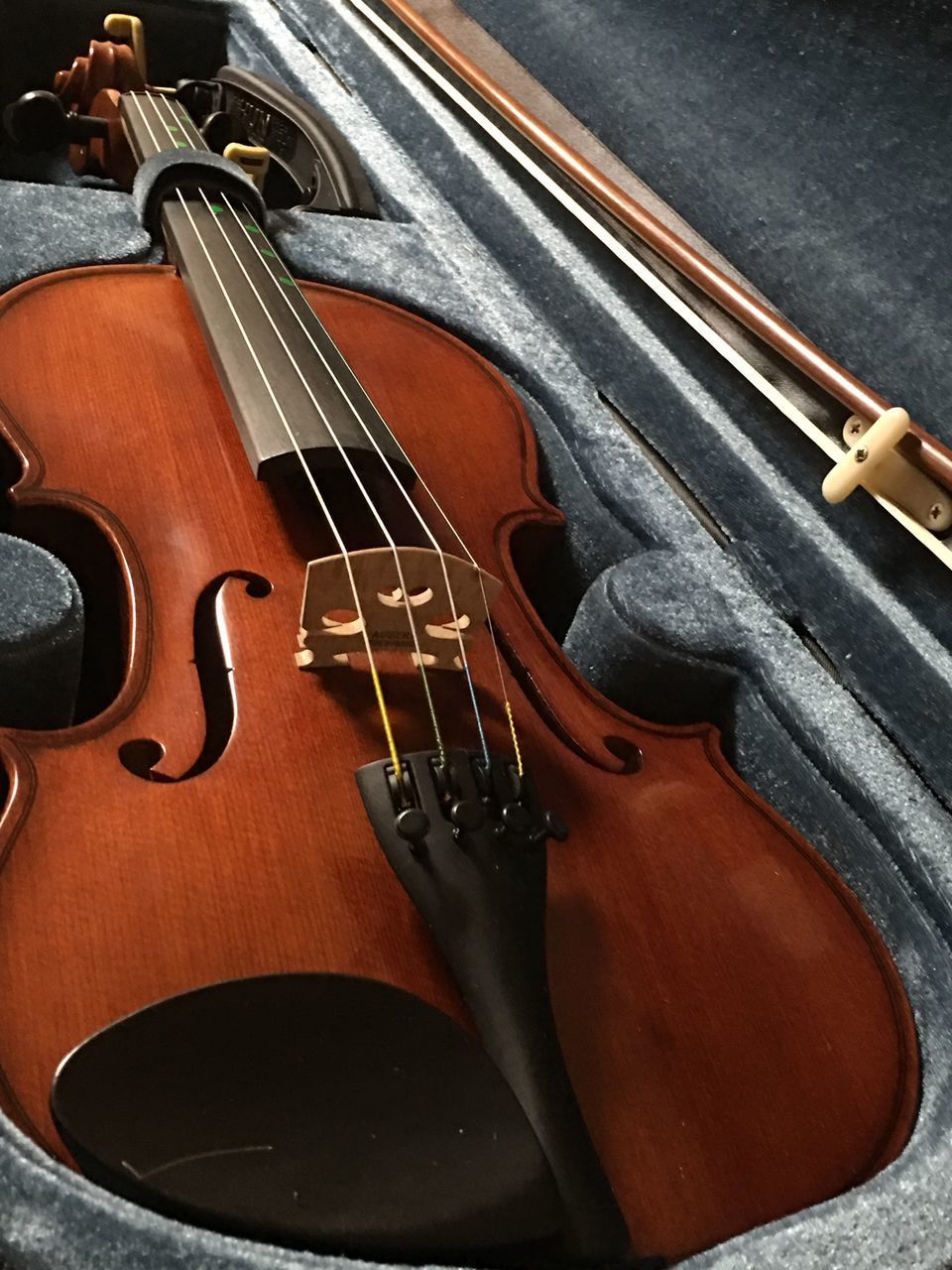 HIGH ANGLE VIEW OF GUITAR AT CAMERA