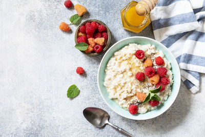 Healthy diet breakfast. oatmeal porridge in ceramic bowl decorated with fresh berries raspberries. 