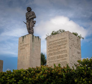 Low angle view of statue against sky