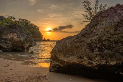 Scenic view of beach against sky during sunset