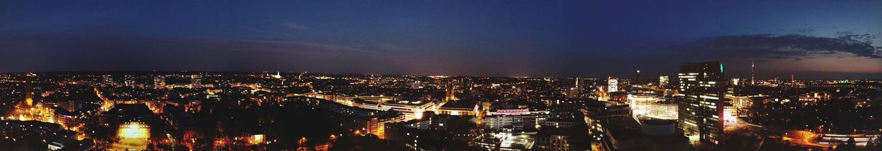 High angle view of illuminated city buildings at night