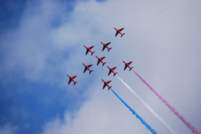 Low angle view of airplane flying in sky