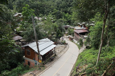 High angle view of road amidst trees and plants in forest