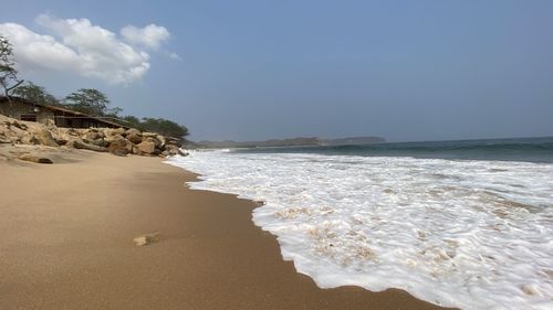 Scenic view of beach against sky