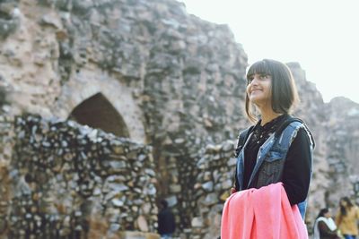 Young woman standing outdoors