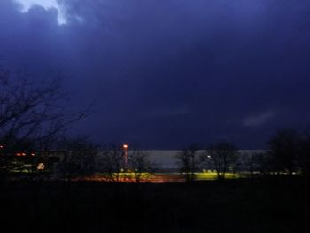 Scenic view of landscape against sky at night