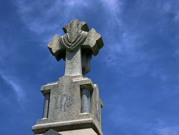 Low angle view of statue against sky