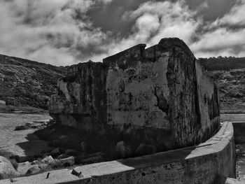 Old ruins of building against cloudy sky