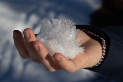 Close-up of hand holding ice cream