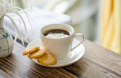 Close-up of coffee and cup on table