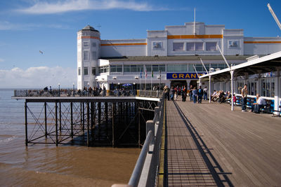 People in front of built structure