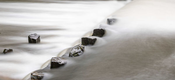 Close-up of rocks by sea