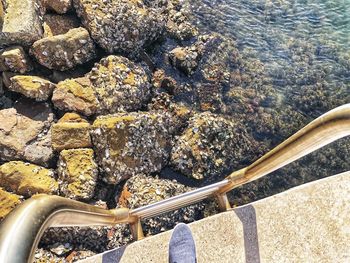 High angle view of rocks by sea