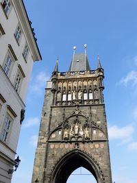 Low angle view of clock tower against sky