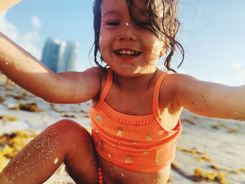 Portrait of smiling sitting on beach