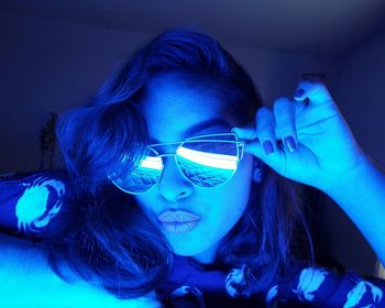 Portrait of young woman wearing sunglasses