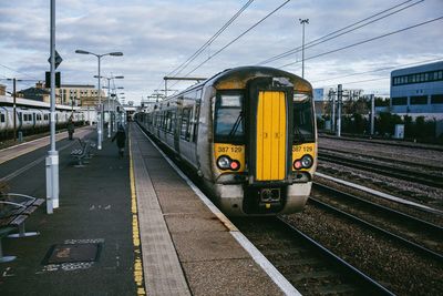 Train on railroad station platform against sky