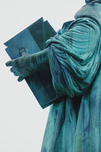 Low angle view of statue against sky