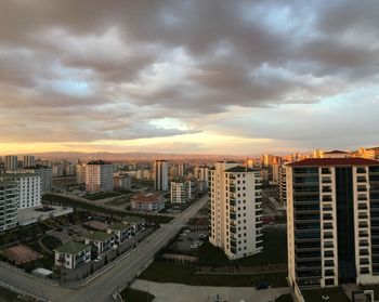 High angle view of buildings against sky during sunset