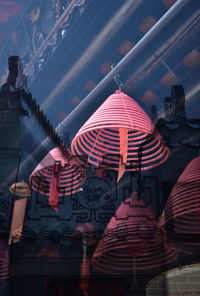 Low angle view of red flags against building