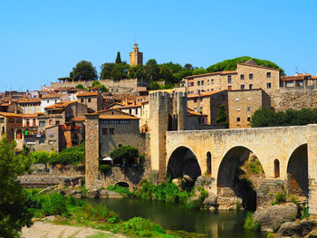 Bridge over river against clear sky