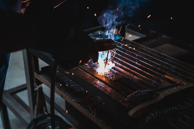 High angle view of man preparing food on barbecue