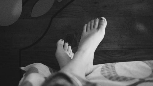 Low section of woman relaxing on floor